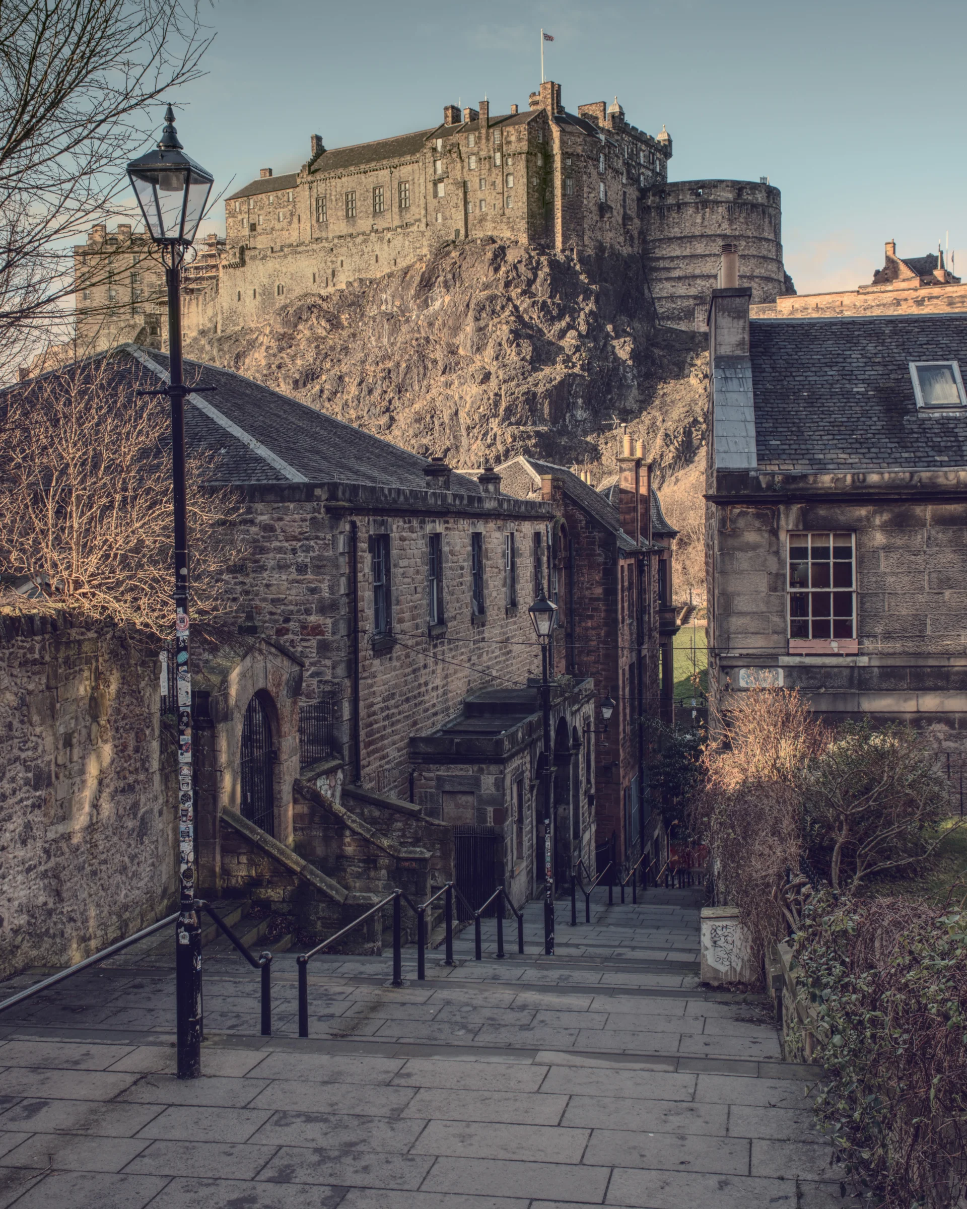 There's a strong chance this image contains the following subjects: house,  architecture,  street,  travel,  building,  scotland,  castle,  edinburgh. The photographer has provided the following description: The steps of The Vennel, leading the eye towards Edinburgh Castle. Photographer_name: Chris Michael. Title: The Vennel. The photographer has provided the following description: The steps of The Vennel, leading the eye towards Edinburgh Castle. Make: fujifilm. Model: X-T5. Technical: 16-80mm. Published: 2025-09-08 17:00:54