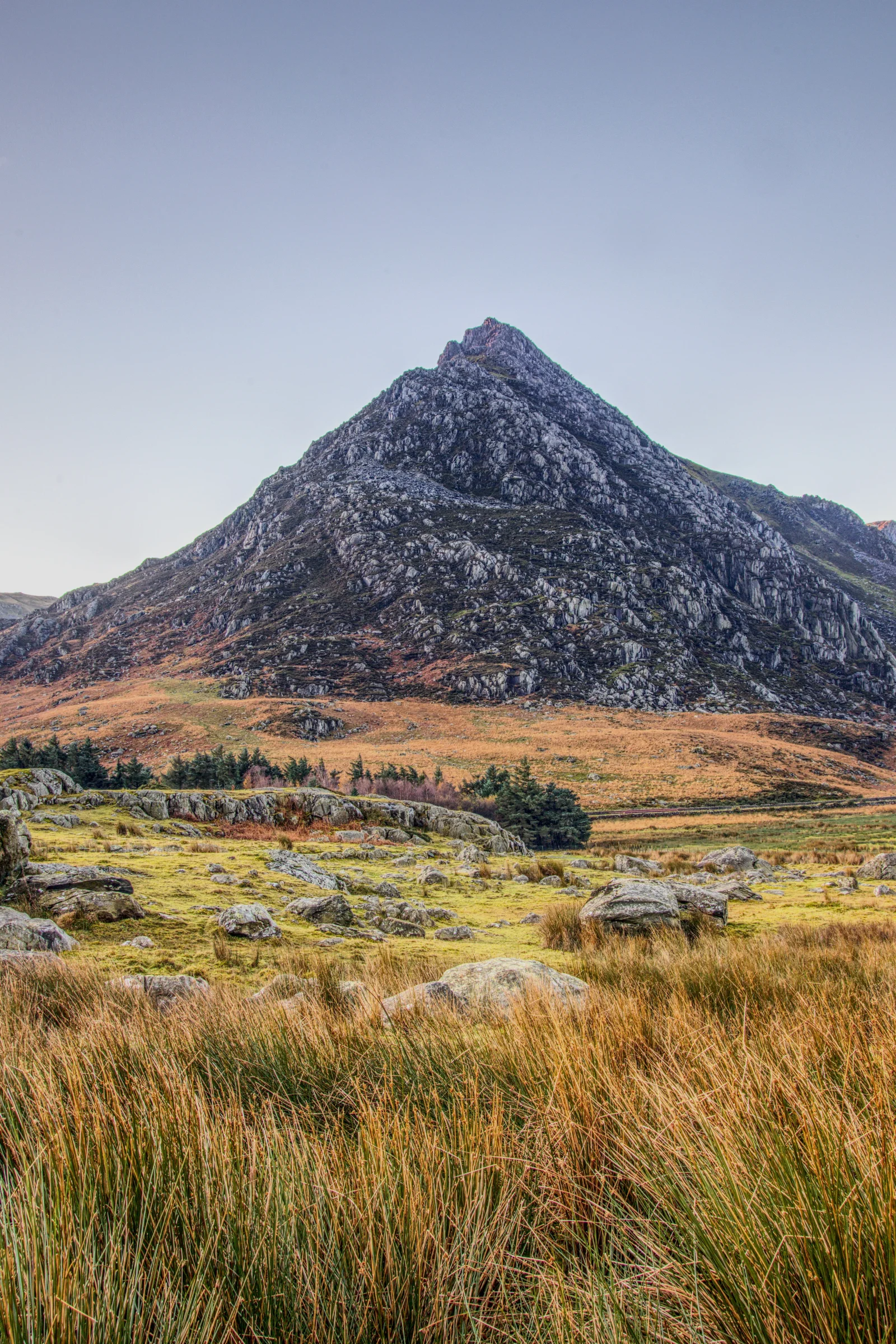 There's a strong chance this image contains the following subjects: sky,  landscape,  travel,  nature,  wales,  snowdonia,  eryri,  eryrinationalpark,  nationalpark,  snowdon,  tryfan. The photographer has provided the following description: This is Tryfan, photographed in Wales around late-Winter 2023. Photographer_name: Chris Michael. Title: Tryfan. The photographer has provided the following description: This is Tryfan, photographed in Wales around late-Winter 2023. Make: fujifilm. Model: X-T5. Technical: 16-80mm. Published: 2025-09-09 16:16:14