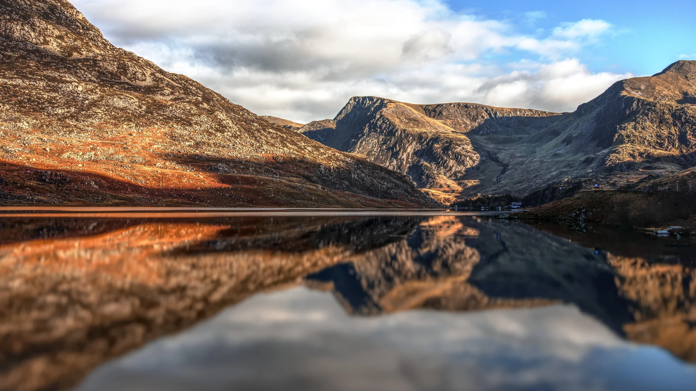 There's a strong chance this image contains the following subjects: sky,  water,  landscape,  lake,  travel,  nature,  wales,  snowdonia,  eryri,  eryrinationalpark,  nationalpark,  snowdon,  reflections. The photographer has provided the following description: Reflections on Llyn (lake) Ogwen. Photographer_name: Chris Michael. Title: Reflections. The photographer has provided the following description: Reflections on Llyn (lake) Ogwen. Make: canon. Model: EOS R. Technical: 16mm. Published: 2025-09-09 16:54:46