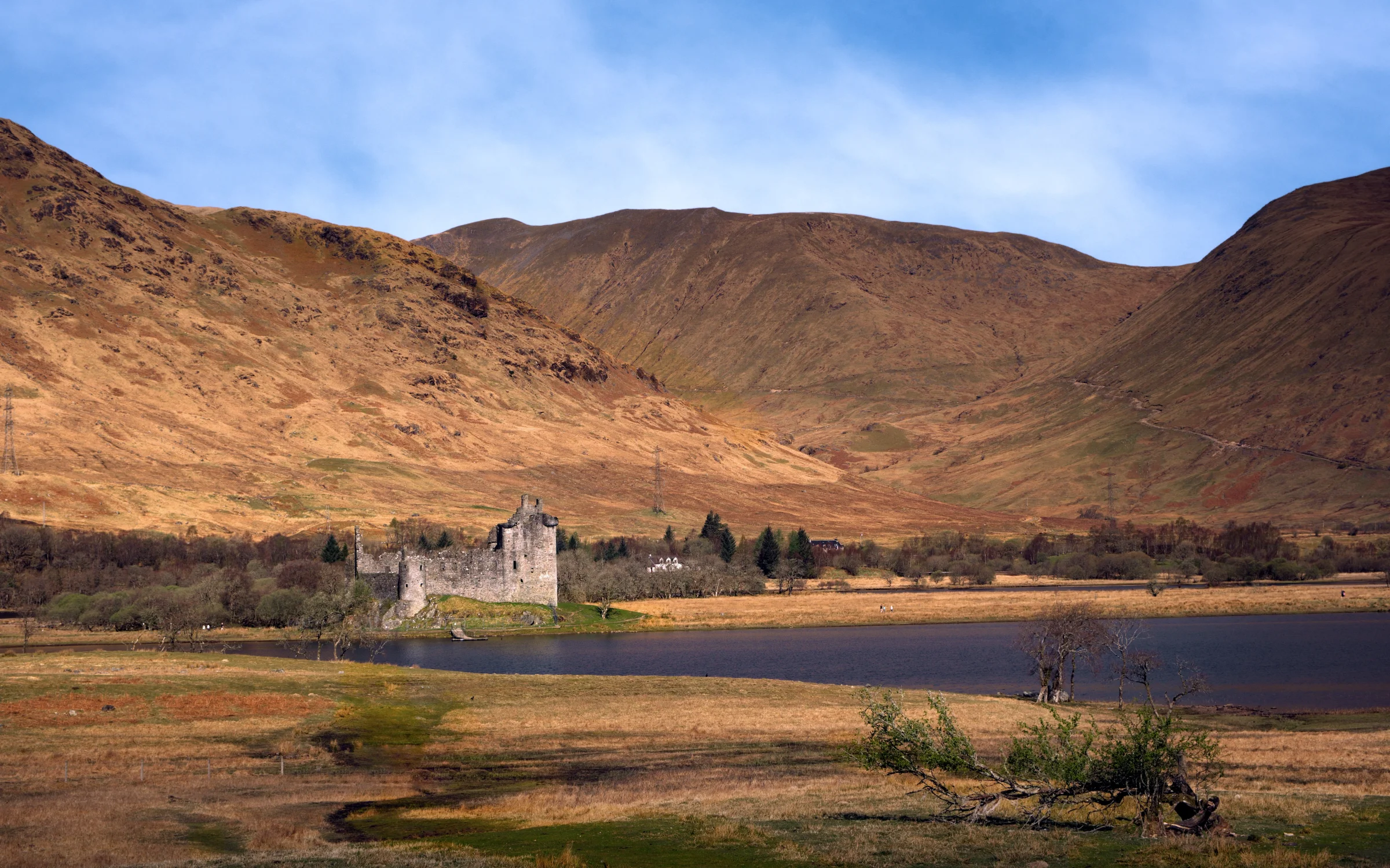 There's a strong chance this image contains the following subjects: water,  landscape,  lake,  travel,  nature,  scotland,  highlands,  scottishhighlands,  castle. The photographer has provided the following description: Time to pull over in the car and capture this little beauty...the ruins of Kilchurn Castle in the Scottish Highlands. Photographer_name: Chris Michael. Title: Kilchurn Castle. The photographer has provided the following description: Time to pull over in the car and capture this little beauty...the ruins of Kilchurn Castle in the Scottish Highlands. Make: fujifilm. Model: X-T5. Technical: 16-80mm at 16mm. Published: 2025-09-08 16:42:43