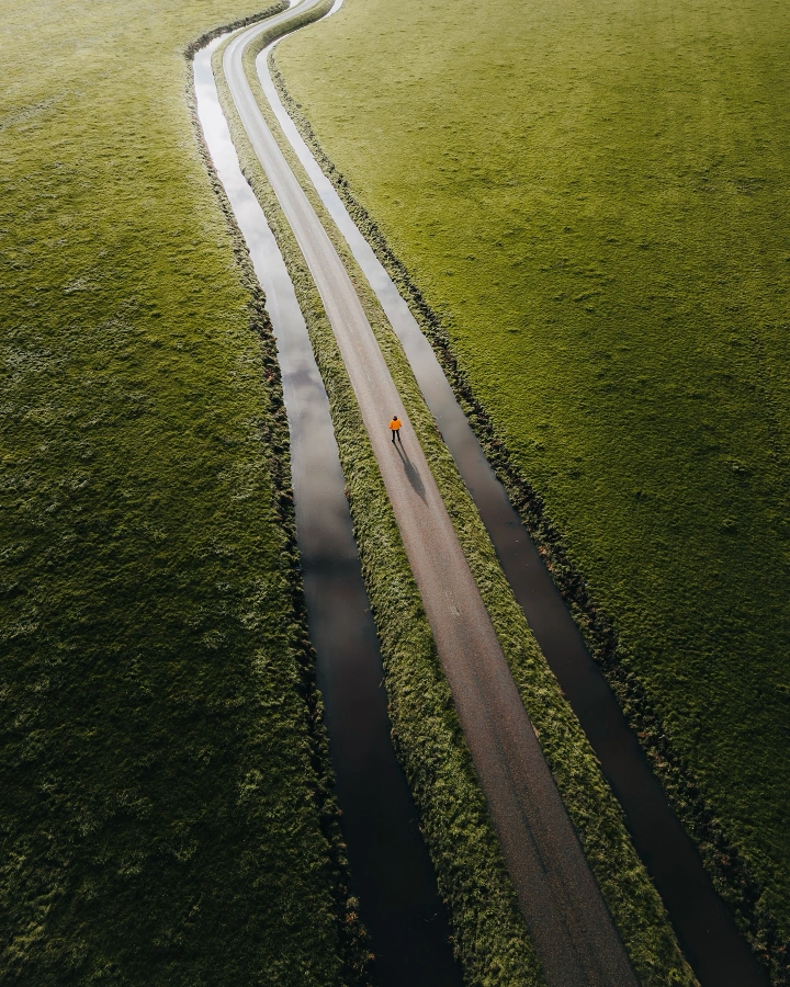There's a strong chance this image contains the following subjects: water,  nature,  road. Source: https://www.instagram.com/larissavanhooren/ Photographer_name: Larissa Van Hooren. Title: This is Holland. Published: 2025-07-08 09:01:36