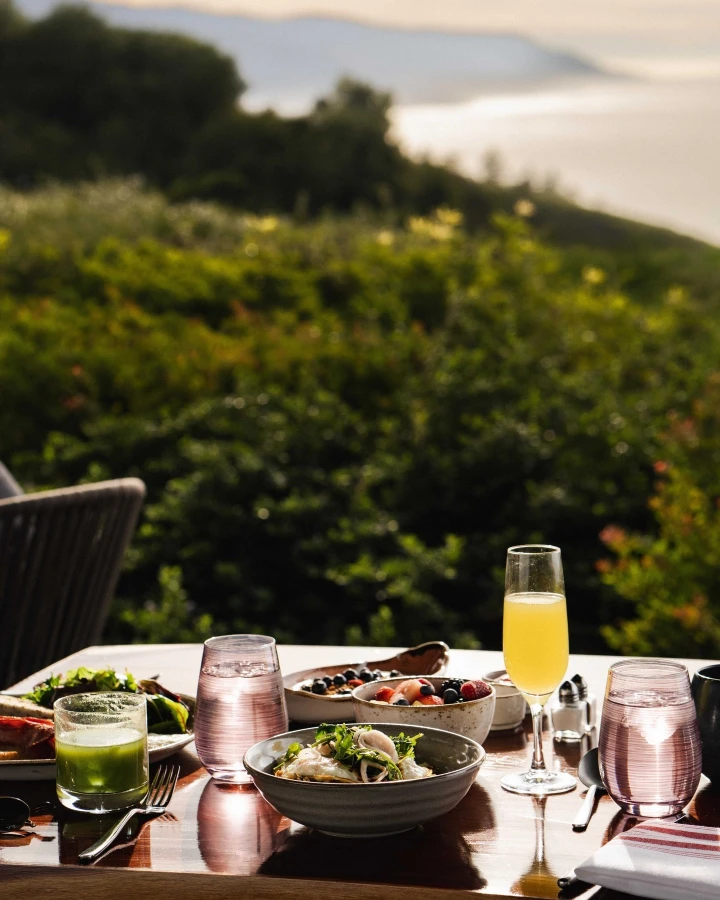 There's a strong chance this image contains the following subjects: table. The photographer has provided the following description: Celebrating the rich bounty of land and sea that surrounds it, offering a dining experience that fuels the adventures ahead. FOTO has this to say about the photograph: Serene. With thoughtful composition and warm natural light, creating depth and atmosphere. Every element, from the colour palette to the soft shadows, works together to evoke a sense of peaceful indulgence. Source: https://www.instagram.com/ventanabigsur/ Photographer_name: Take Out Creative. Title: The Sur House. The photographer has provided the following description: Celebrating the rich bounty of land and sea that surrounds it, offering a dining experience that fuels the adventures ahead. FOTO has this to say about the photograph: Serene. With thoughtful composition and warm natural light, creating depth and atmosphere. Every element, from the colour palette to the soft shadows, works together to evoke a sense of peaceful indulgence. Published: 2025-06-16 15:21:11