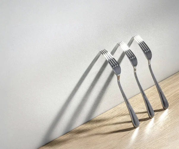 There's a strong chance this image contains the following subjects: still life,  product,  negative space. The photographer has provided the following description: Playing with light and shadow to create something a little different, Got to love a bit of strong directional lighting. FOTO has this to say about the photograph: The photograph demonstrates a clean, intentional composition. The placement of the forks creates a subtle rhythm, with their lines drawing the eye diagonally through the frame. The use of negative space adds clarity, while the controlled lighting highlights texture without distraction. It’s a quiet, well-balanced study in form and simplicity. Source: https://www.instagram.com/carltonphotographer/ Photographer_name: Carlton Adkins. Title: Light and shadow. The photographer has provided the following description: Playing with light and shadow to create something a little different, Got to love a bit of strong directional lighting. FOTO has this to say about the photograph: The photograph demonstrates a clean, intentional composition. The placement of the forks creates a subtle rhythm, with their lines drawing the eye diagonally through the frame. The use of negative space adds clarity, while the controlled lighting highlights texture without distraction. It’s a quiet, well-balanced study in form and simplicity. Published: 2025-06-27 22:54:36