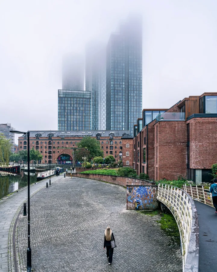 There's a strong chance this image contains the following subjects: architecture,  street,  fog,  travel,  mist,  city,  building,  urban,  skyline. Source: https://www.instagram.com/flossietakesphotos/ Photographer_name: Flossie. Title: Fading into the Mist. Published: 2025-06-25 09:06:54