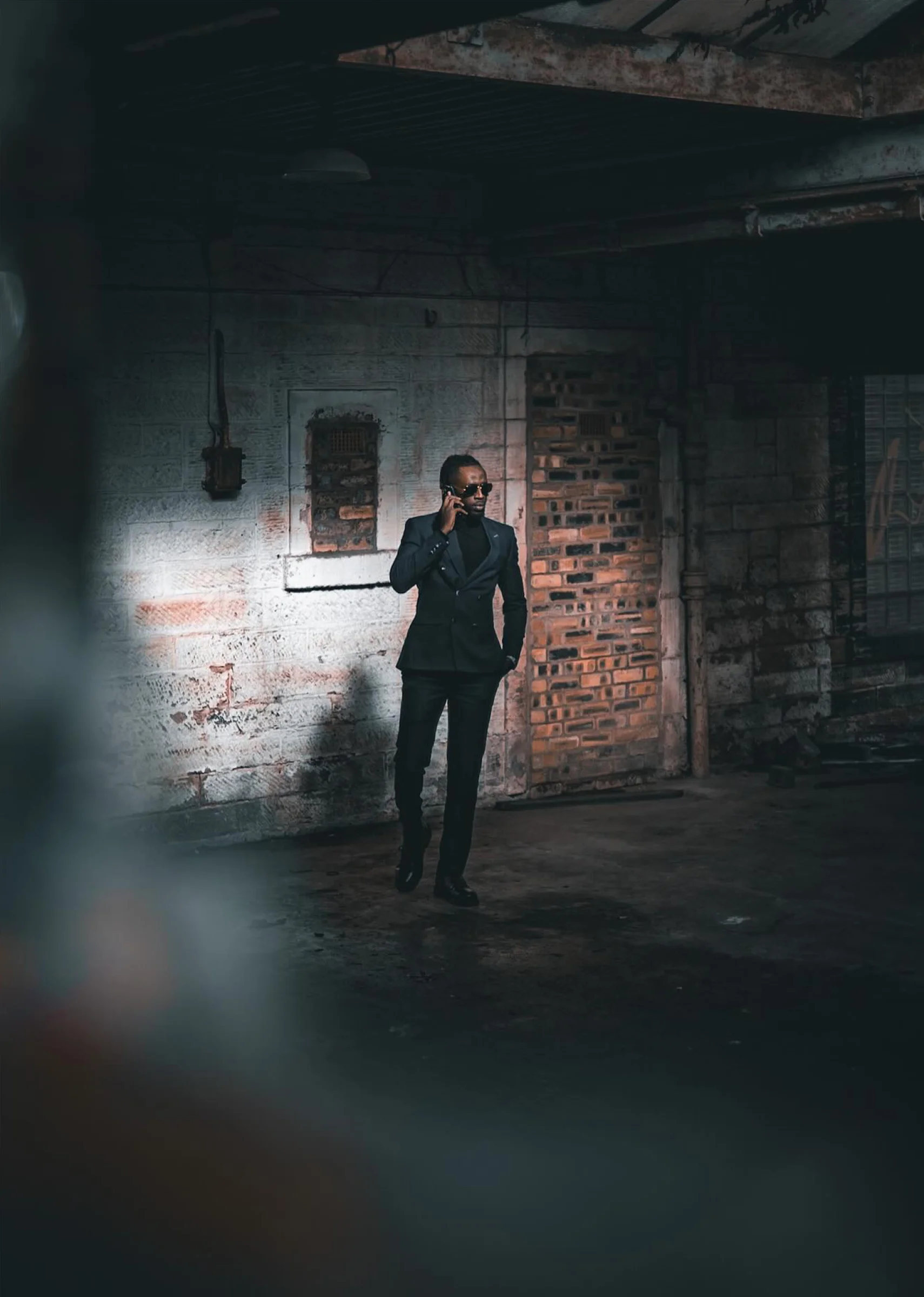 There's a strong chance this image contains the following subjects: portrait. The photographer has provided the following description: Somewhere in the back streets of Glasgow, where rust, shadows, and silence become part of the frame. A cinematic moment caught between light and decay. Source: https://www.instagram.com/orb.photograph/ Photographer_name: Bryan. Title: Unapolagetic. The photographer has provided the following description: Somewhere in the back streets of Glasgow, where rust, shadows, and silence become part of the frame. A cinematic moment caught between light and decay. Published: 2025-10-12 15:17:57