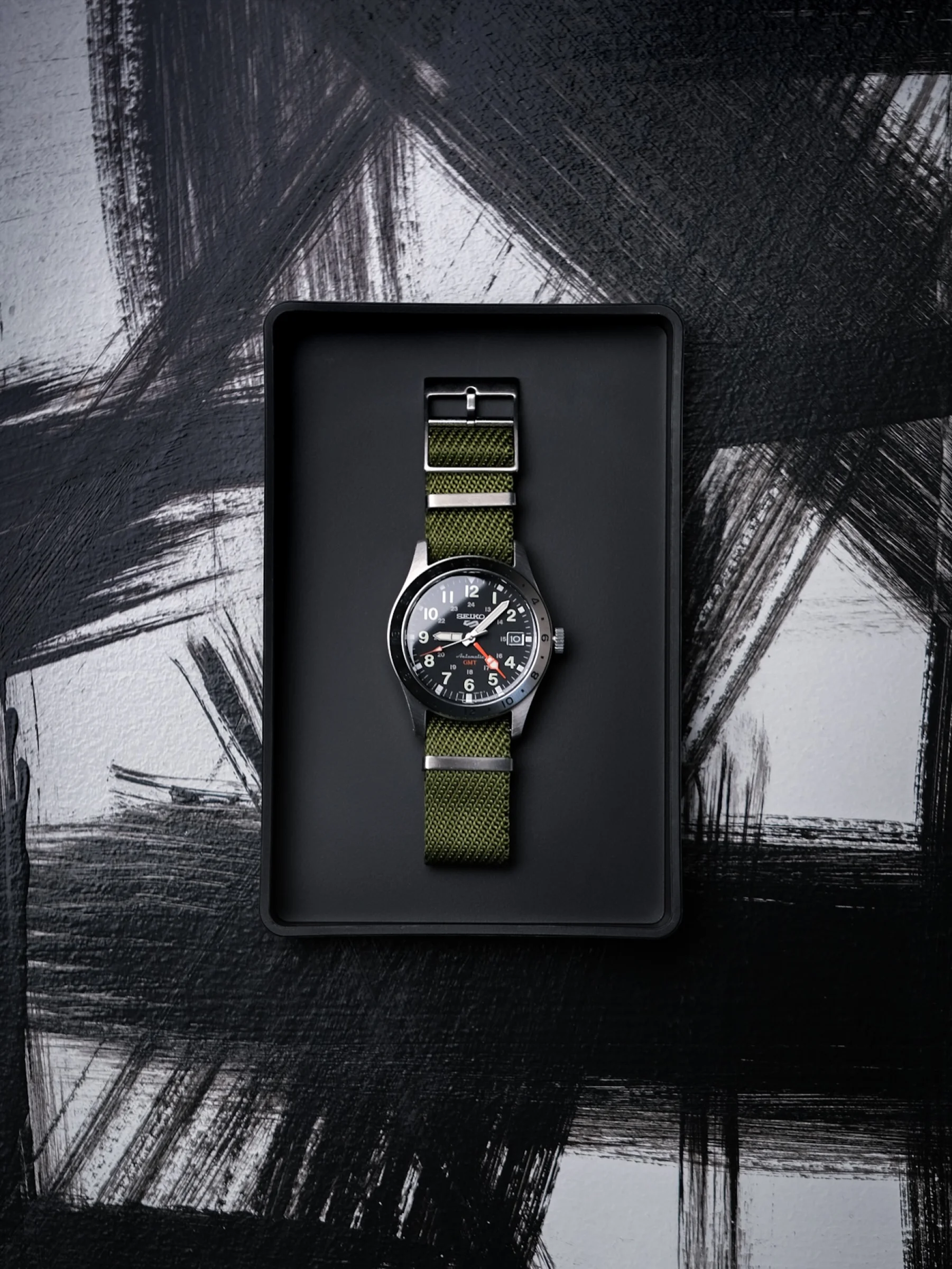 There's a strong chance this image contains the following subjects: product. Source: https://www.instagram.com/gearedd/ Photographer_name: Sami Viljanen. Title: Seiko 5. Published: 2025-10-12 16:15:23