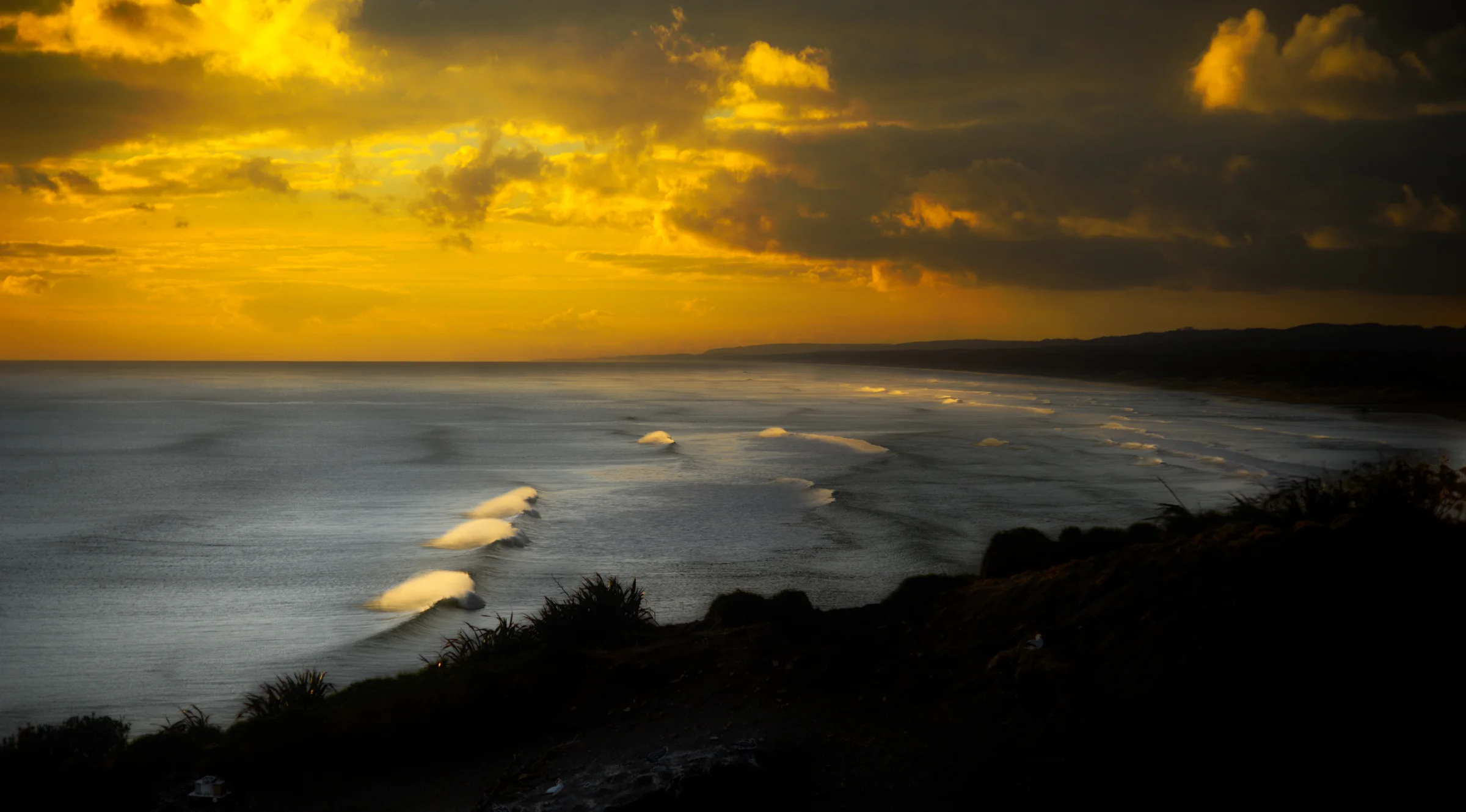 There's a strong chance this image contains the following subjects: landscape,  sea,  sunset. The photographer has provided the following description: Muriwai Beach New Zealand Photographer_name: Robert A F van de Voort. Title: sun down. The photographer has provided the following description: Muriwai Beach New Zealand Make: nikon. Model: D800. Technical: 210 - 70 mm Nikkor.. Published: 2026-06-03 04:14:36