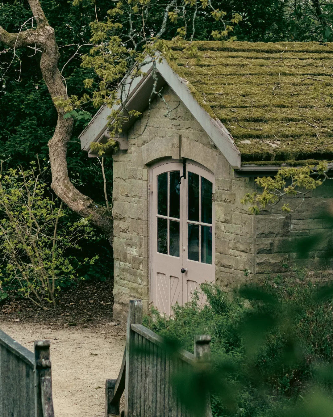 There's a strong chance this image contains the following subjects: tree,  garden,  architecture. The photographer has provided the following description: Nestled within some trees, on the shores of the Lyme house lake, this little out-building looked really quaint and fantastical. FOTO has this to say about the photograph: Set against the serene backdrop of Lyme Park, this charming lakeside outbuilding exudes timeless elegance. The photographer masterfully captures not only its picturesque presence but also the tranquil atmosphere and unique perspective that make the scene feel both intimate and cinematic. Photographer_name: Lee Sillery. Title: Tranquil Hideout. The photographer has provided the following description: Nestled within some trees, on the shores of the Lyme house lake, this little out-building looked really quaint and fantastical. Make: sony. Model: a7Rii. FOTO has this to say about the photograph: Set against the serene backdrop of Lyme Park, this charming lakeside outbuilding exudes timeless elegance. The photographer masterfully captures not only its picturesque presence but also the tranquil atmosphere and unique perspective that make the scene feel both intimate and cinematic. Published: 2025-06-20 06:28:49